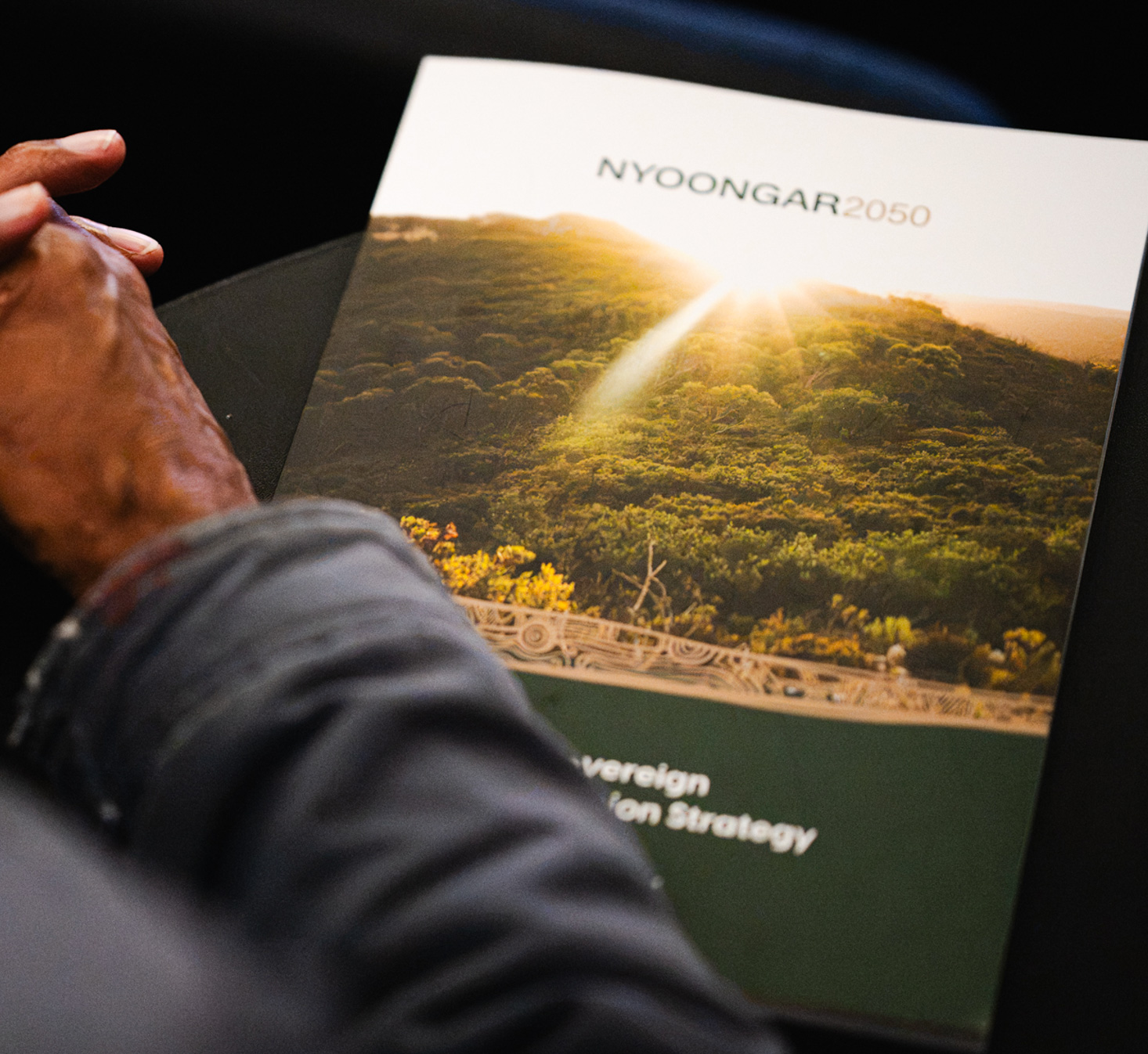 An Elder holding the Nyoongar 2050 Sovereign Wealth Strategy